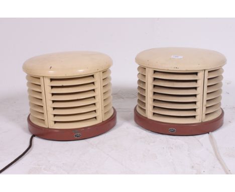 A pair of vintage 1950's Art Deco HMV heaters in the manner of Christian Bauman. The grilled enamel metal bodies complete wit