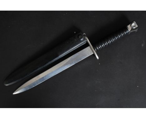 A 20th century Dutch Army bayonet dagger complete with composite scabbard. The shaped blade marked F+ with additional marks K