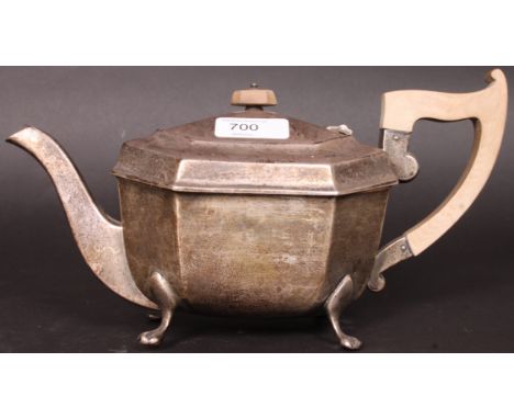 A silver hallmarked teapot marked for Edward Viner having faux ivory handle and final, raised on claw feet. Sheffield hallmar