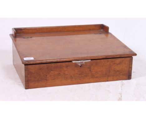 A vintage 1930's clerks table top desk having hinged top with recess beneath