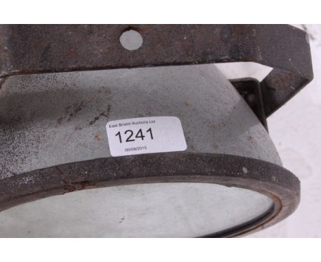 A vintage retro industrial spot light  along with a vintage heat lamp