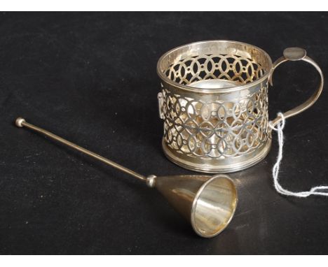 A silver hallmarked fret pierced silver chamber candlestick and holder inset together with a snuff. Hallmarks for Birmingham 