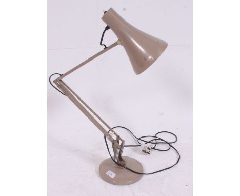 A vintage Herbert Terry anglepoise industrial desk lamp in beige. Raised on circular base with pendant shade