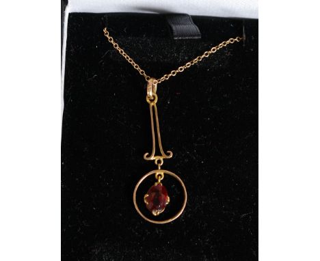 A 9ct gold and ruby garnet stone ladies necklace and pendant set. Stamped 9ct gold with presentation box.