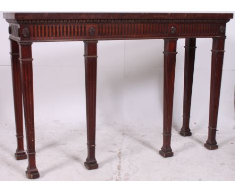 A Regency Irish style mahogany  console table having reeded tapered legs with spade feet having reeded fitted frame and flare