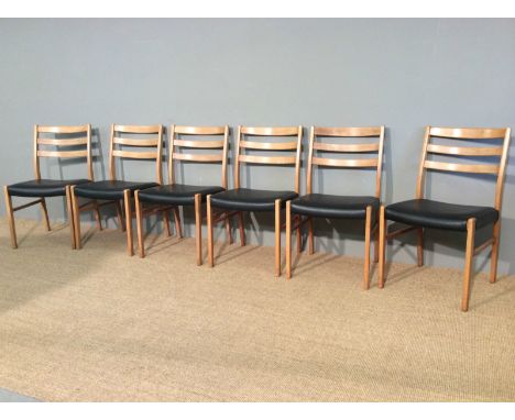 A set of 6 vintage retro dining chairs, Solid beech frames, with a medium varnish finish, with original black vinyl seat pads