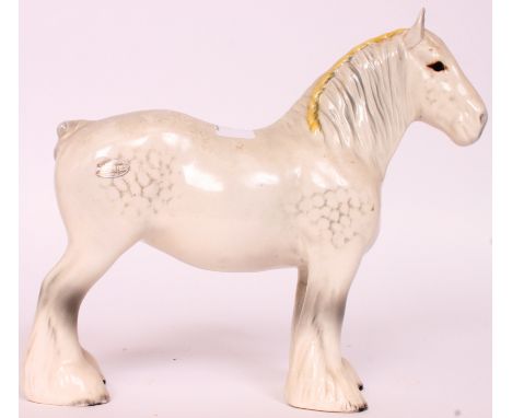 A Beswick ceramic figurine of a Shire Horse having white  / yellow braid H23cm