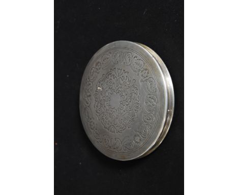 A silver hallmarked ladies compact stamped for London, bearing makers marks G H P Ltd date letter for 1946 having a chase dec