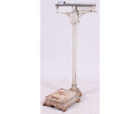 A vintage large Industrial set of medical weighing scales by Berry & Warminster of Liverpool. Cast Iron with white painted fi