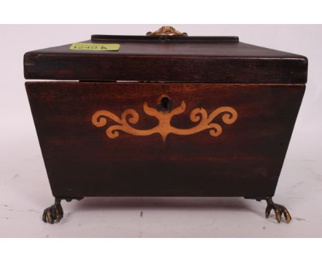 A Georgian sarcophagus marquetry inlaid shaped tea caddy, with brass finial to top, bird claw feet and inlaid detail to the l