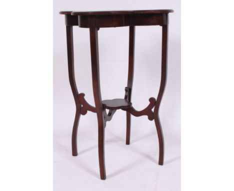An Edwardian mahogany inlaid clover leaf side table raised on squared supports with lower tier beneath clover shaped top abov