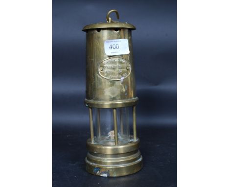 A vintage brass miners lamp bearing plaque for Ferndale Coal and Mining Company