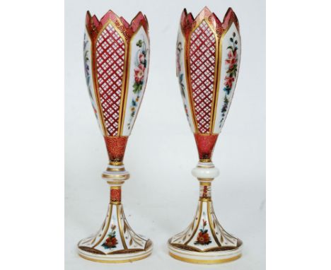 A pair of Bohemian 19th Century Bohemian tulip vase in the manner of Moser with spread foot, knopped stem and tall body cased