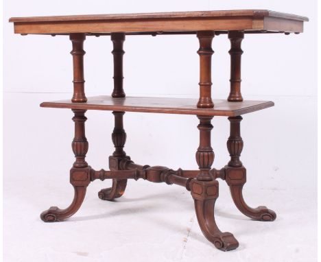 An excellent Victorian mahogany two tier etagere whatnot side lamp table. Raised on c-scroll feet with cross stretchers havin