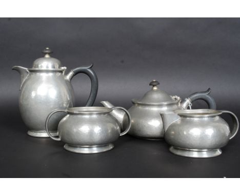 A Liberty ' Tudric ' 4 piece coffee / tea service to include coffee pot, teapot. creamer and sugar bowl being stamped to the 