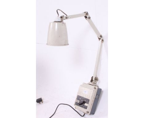 An early 20th century industrial wall mounted adjustable Memlite  anglepoise light, with the original switch. H110cm