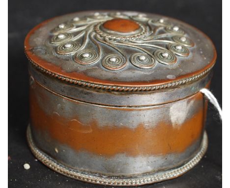 A fabulous copper and silver plated trinket box of cylindrical form having applied decorative top in the manner of John  Paul