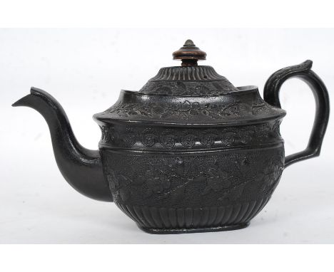 A 19th century black basalt ware Victorian teapot with lid and wooden finial having impressed mark to the base. Believed Wedg