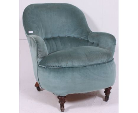 A Victorian mahogany chesterfield style tub armchair. The mahogany turned legs with ceramic castors having tub style frame wi