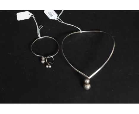 A silver modernist ladies choker necklace, bangle and ring set all being marked Sterling. Each with fabulous ball finial styl