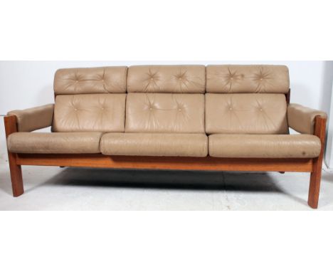 A retro 1970's Norwegian teak and cream leather sofa by Ekornes. The teak show wood frame with original cream leather upholst