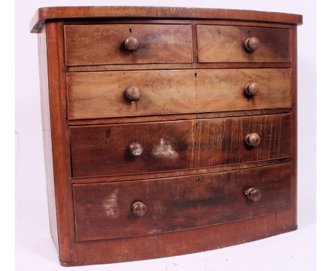 A Victorian bow front mahogany chest of drawers. 2 short over 3 deep drawers having knob handles to each H100 W118  D 52 cm