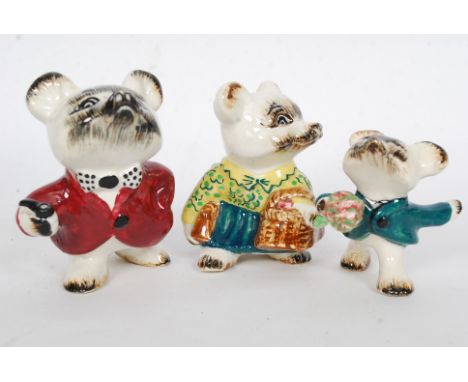 A family of goldscheider figurines, comprising of two adults and child. Each stamped to the base. 