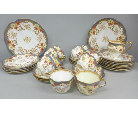 A Staffordshire tea service comprising of ten teacups, eleven saucers, eleven plates, two serving plates and milk jug, a/f  *