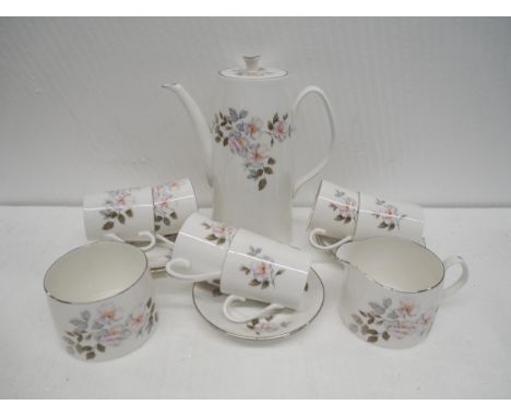 A porcelain Princess House Melody tea set and casserole dish together with a Royal Adderley bone china Silver Rose coffee set