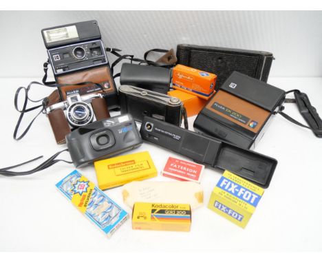 A collection of cameras and camera accessories to include Ferrania Ibis 44, Kodak Instamatic 233-x, Minolta AF-DL, and others