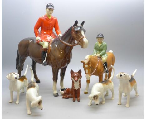 A collection of Beswick hunting figures, Huntsman a/f, boy on pony, four hounds, one a/f, and a fox  **PLEASE NOTE THIS LOT I
