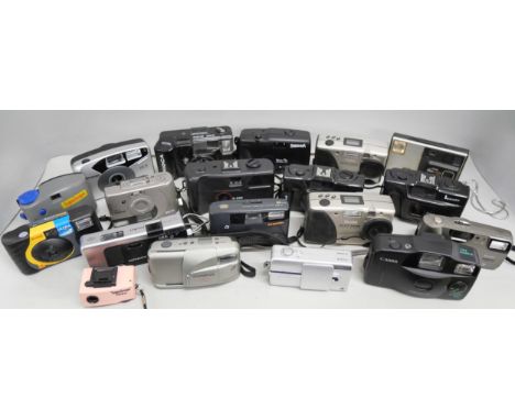 A collection of digital and film cameras. Examples include Panorama Wide Pie, Kodak DC215 Zoom, Canon Snappy LX, Olympus Newp