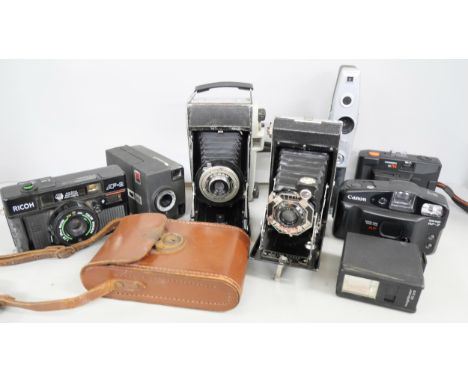 A collection of cameras including Hanimex, Kodak Concertina with leather case, Ricoh, Kodak Junior One, Kodak Instamatic, Can