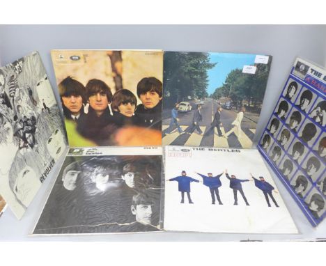 Ten The Beatles LP records, including No. 0387450 White Album, with lyric sheet and four photographs but not John, two of Geo