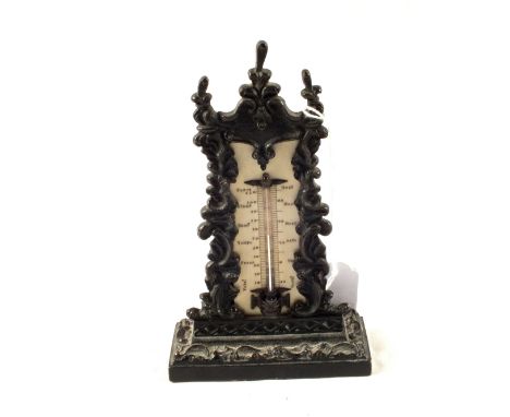 A Victorian thermometer in Iron decorative surround
