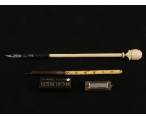 An Ivory pomander and pen, one other pen and a miniature harmonica 