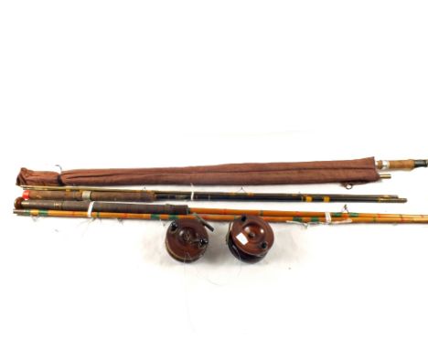 Three fishing rods and two vintage reels
