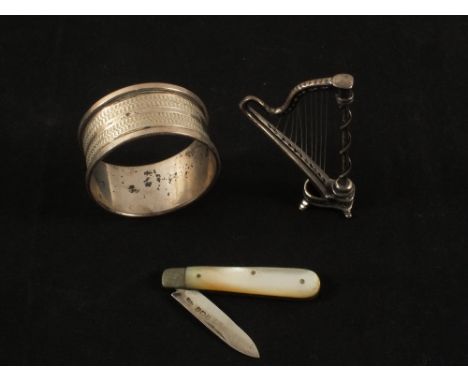 A Silver and Mother of Pearl fruit knife, serviette ring and miniature harp (unmarked)