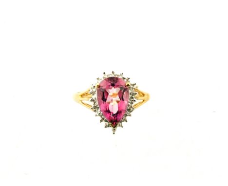 A 9ct Gold ring set with tear drop pink stone surrounded with Diamond chips, size O