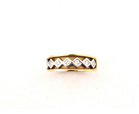 A 9ct Gold half eternity ring set with seven small Diamonds, size N