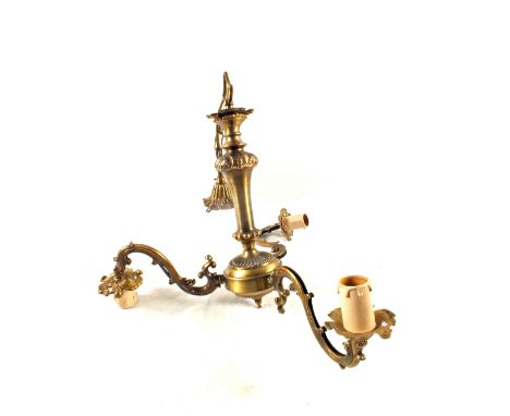 An Art Deco inlaid striking mantel clock and three branch ceiling light