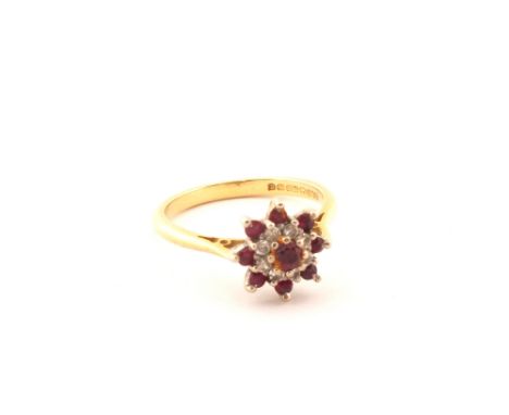 An 18ct Gold Diamond and Ruby cluster ring, size P