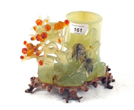 A florally carved Jade Chinese brush pot on carved wooden stand, height 5 1/2"