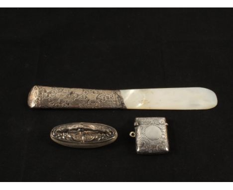 A Silver vesta, Birmingham 1903, a nail buffer and a Mother of Pearl page turner, London 1904