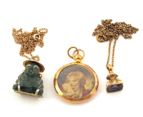 A yellow metal chain and seal, a 9ct Gold picture locket and a 9ct Gold chain with Jade Buddha