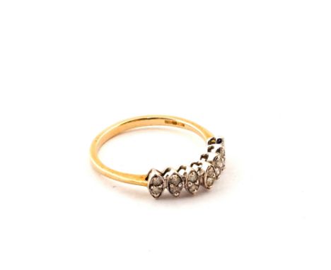 A 9ct Gold ring set with a double row of fourteen small Diamonds, size P