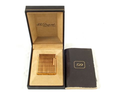 A cased Dupont gilt coloured engine turned lighter