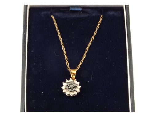 A 9ct Gold chain with a Sapphire and Diamond pendant