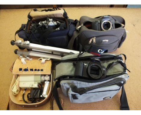 Nikon, Minolta and Canon cameras and a large quantity of accessories including tripod and Minolta Cine camera