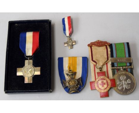 A WWII British Red Cross Award medal, engraved 'M Olink' on reverse and with a 'Proficiency in Red Cross First Aid' bar, moun